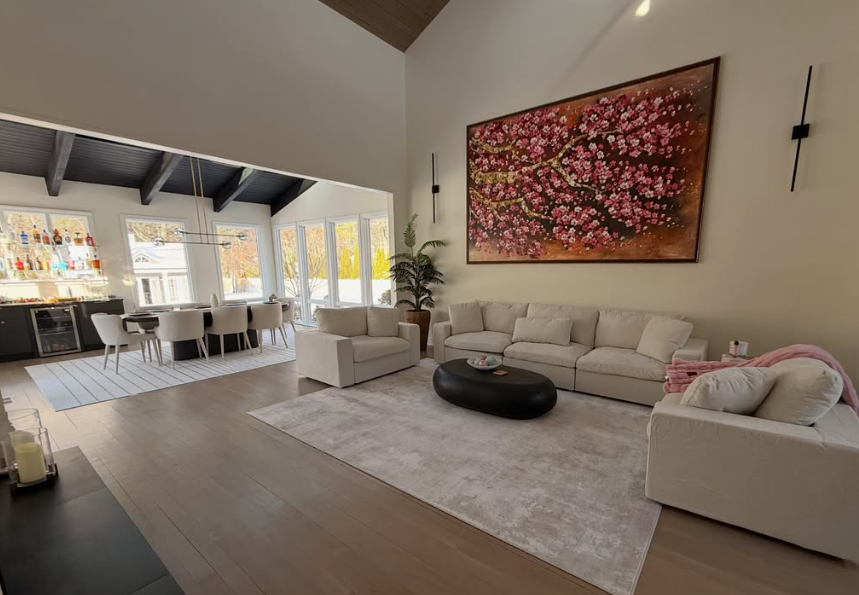 Renovated great room with vaulted ceiling and open dining area